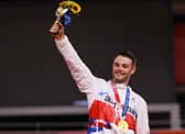 Gold medalist Matthew Walls of Team Great Britain, poses on the podium during the medal ceremony after the Men's Omnium final of the track cycling (Photo by Tim de Waele/Getty Images)