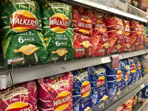 Crisp packets in the supermarket (Shutterstock)