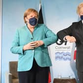 Prime Minister Boris Johnson greets German Chancellor Angela Merkel, ahead of a bilateral meeting during the G7 summit in Carbis Bay (Photo: Stefan Rousseau - WPA Pool/Getty Images)