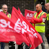 LONDON, ENGLAND - MAY 31: A group of rail workers stand on a picket line outside Euston rail station as a new round of strikes by train drivers begins on May 31, 2023 in London, England. Today's strike comes after the train drivers union, ASLEF, rejected a pay rise offer of 4 percent a year over two years from the Rail Delivery Group (RDG). (Photo by Leon Neal/Getty Images)