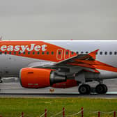 EasyJet has defended its policy of letting its plane crew include their preferred pronouns on name badges despite criticism. (Photo by Horacio Villalobos#Corbis/Getty Images)