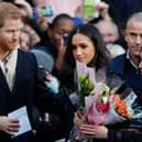 Prince Harry and his then-fiancee, now wife, US actress Meghan Markle arrive to visit the Terrence Higgins Trust World AIDS Day charity fair at Nottingham Contemporary on December 1, 2017