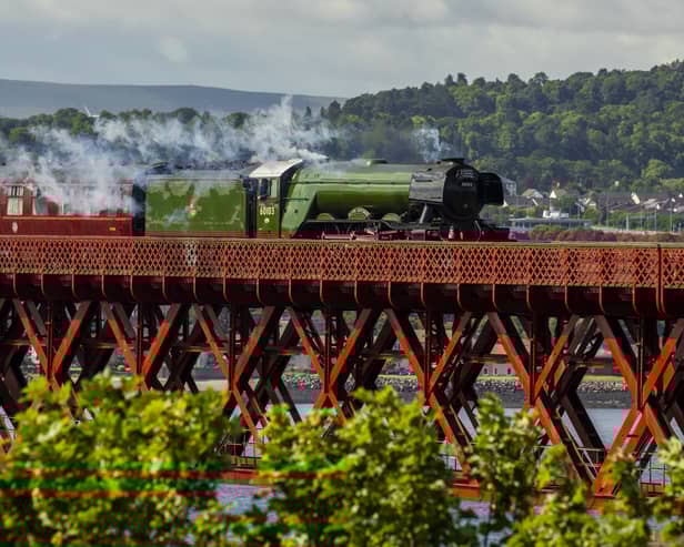 Flying Scotsman passes over the Forth Bridge as part of a series of events to celebrate her centenary. The world famous steam locomotive left Edinburgh before heading north to Aberdeen. 