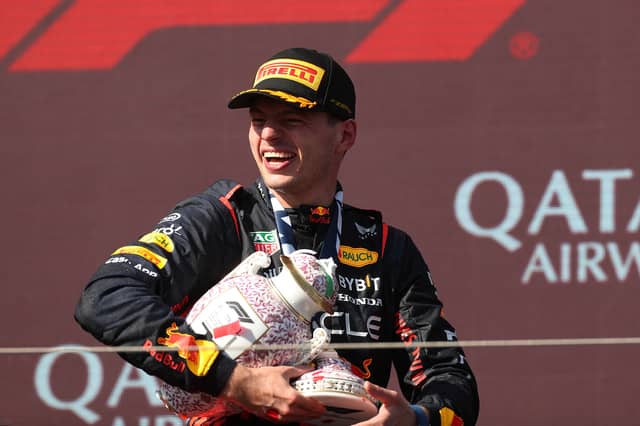 Max Verstappen holds the broken Hungarian Grand Prix trophy