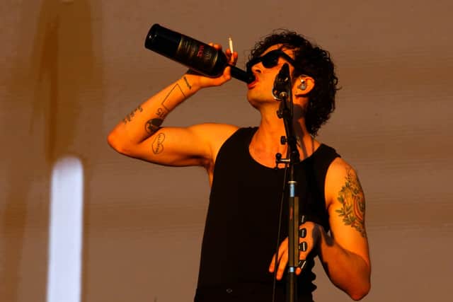The 1975 has been ordered to pay £2.1m in damages or face legal action following an on-stage controversy involving its frontman, Matty Healy (Photo by Marcelo Hernandez/Getty Images)