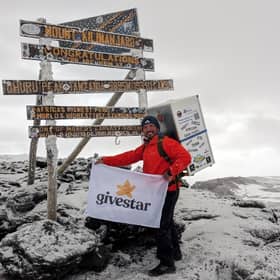 Michael Copeland from Stafford, on his climb up Kilimanjaro with a fridge on his back. The former soldier has conquered Africa's highest mountain whilst carrying a fridge on his back to encourage men to talk about mental health with MIND.