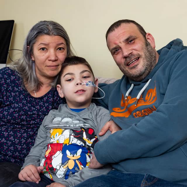 William with his mum Mihaela and dad Simon. William Howard, nine, was told by doctors his initial symptom, a twitch in his right leg, could be down to stress from playing Minecraft but he has a rare and deadly disease.
