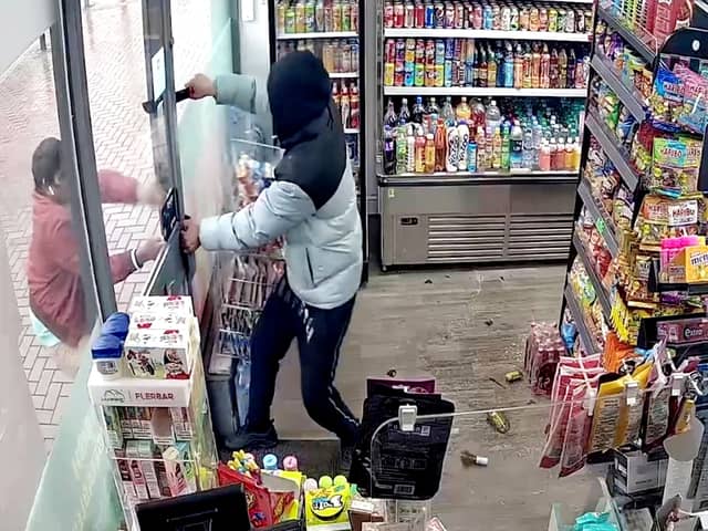 CCTV of an armed robbery where the burglars yielded a machete. 