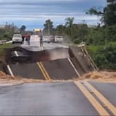 Bridge collapses and plunges into river.