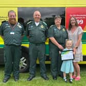 Lola Brisbane and her bravery award from EMAS. 