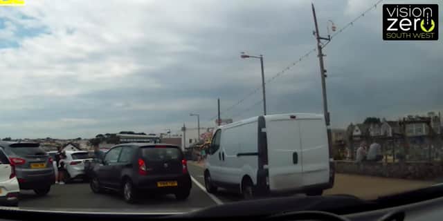 Van drives over busy pavement narrowly missing young girl in Paignton, Devon.