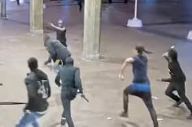 Eight armed men chase teen leaving him with multiple stab wounds.