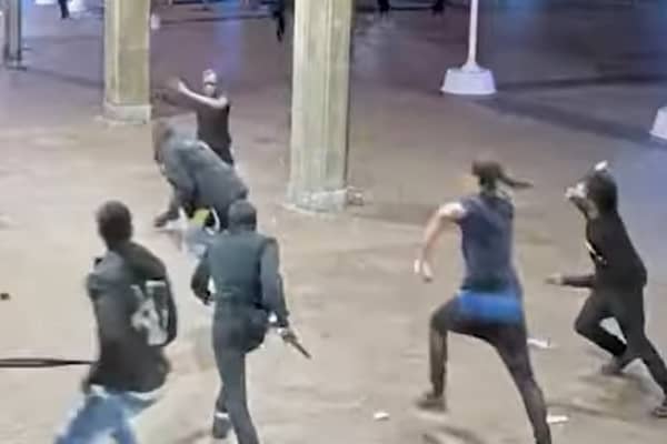 Eight armed men chase teen leaving him with multiple stab wounds.