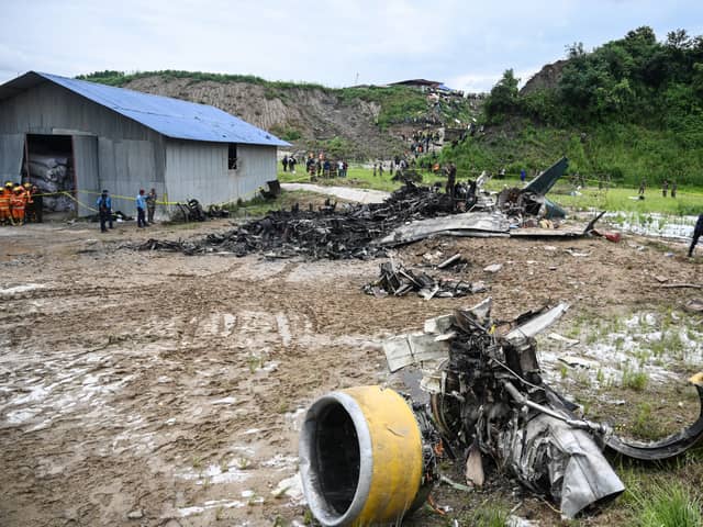 At least 18 people have been killed after a plane skidded off the runway and crashed while attempting take-off in Nepal.