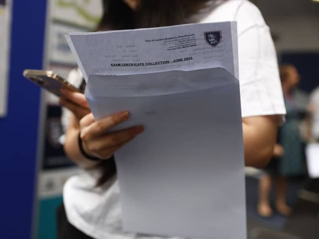 A student receives A-level results. 