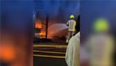 Sixty firefighters tackle blaze at kosher restaurant and flats.