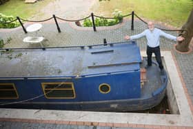 Stephen Cuddy with the mini canal lock he built to house a narrowboat turned into a swimming pool.