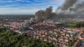 Aerial images show fire fighters tackling flames of a huge fire in Manchester 
