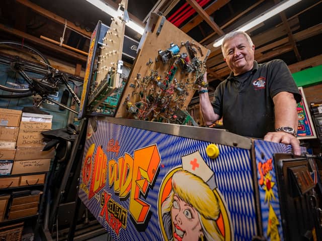 Dr Pinball Mark Squires at his home in Swavesey, Cambridgeshire where he fixes and restores pinball machines.