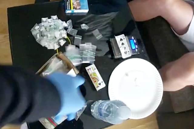 Police raided the flat and found Arnis Rizahi, 25, sitting on a sofa in the living room with 27 bags of cocaine in front of him, along with a set of scales.