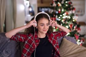 Woman listening to Christmas music.