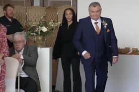 Neil Crossley walks down the aisle at his daughter's wedding, forgetting to take her with him, in Holmfirth, Yorkshire.