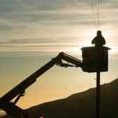 A BT worker fixs telephone lines (Photo: Ashley Cooper/Construction Photography/Avalon/Getty Images)