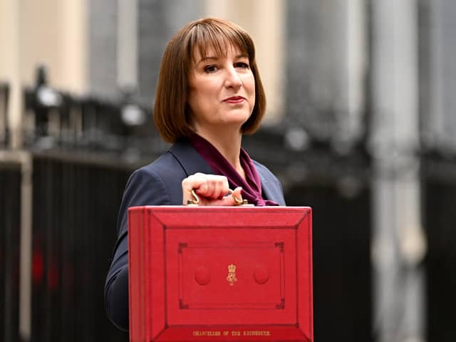 Rachel Reeves, poses with the red Budget Box as she leaves 11 Downing Street to present the government's annual budget to Parliament in October 2024.