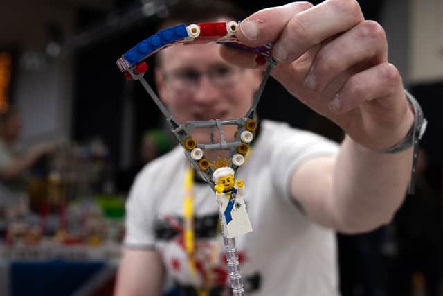 Dave Draper with his parachuting Queen Elizabeth, part of his LEGO replica of the London 2012 Olympic stadium.