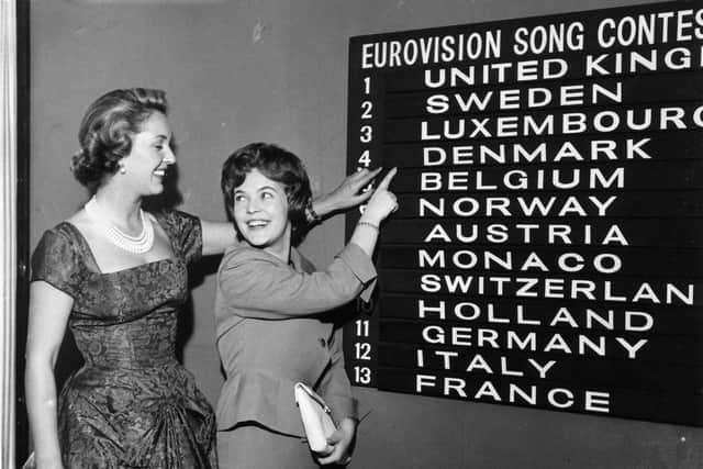 Eurovision Song Contest compere Katie Boyle (on the left) checks the scoreboard for the order of the draw with Katy Bodtger of Denmark.