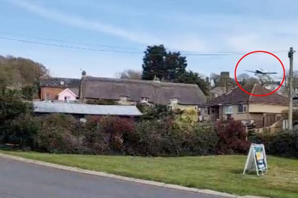 A dramatic video captures the moment a plane came in low and hit a chimney before crashing at an Isle of Wight holiday park.