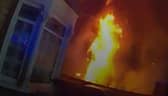 Dramatic moment massive house fire rages as police race to evacuate street.