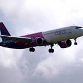 A Wizz Air jet comes in to land at Gatwick Airport. The airline will train 1,200 new pilots by 2028, including 240 based in the UK (Photo: BEN STANSALL/AFP via Getty Images)