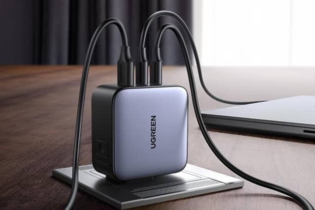 The UGREEN 65W charger can charge multiple devices from a single plug in more than 150 countries.