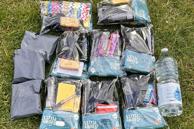 Packs and sanitary products lined out before a distribution session