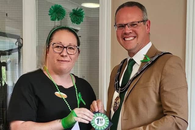The Mayor presents Cheryl with her winner's rosette