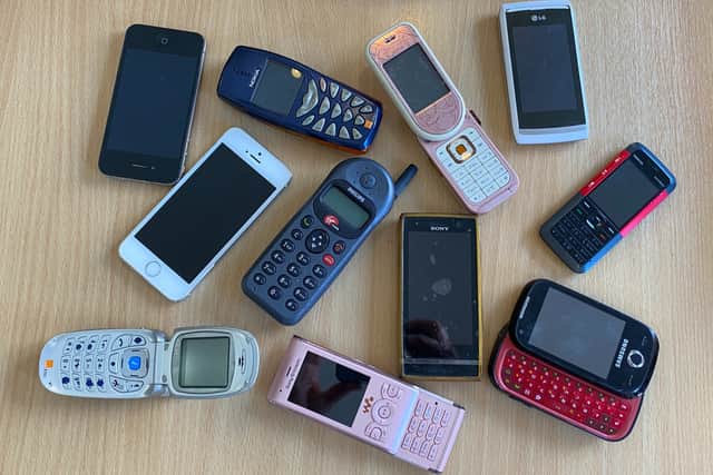 Selection of mobile phones of different ages donated at e-waste week