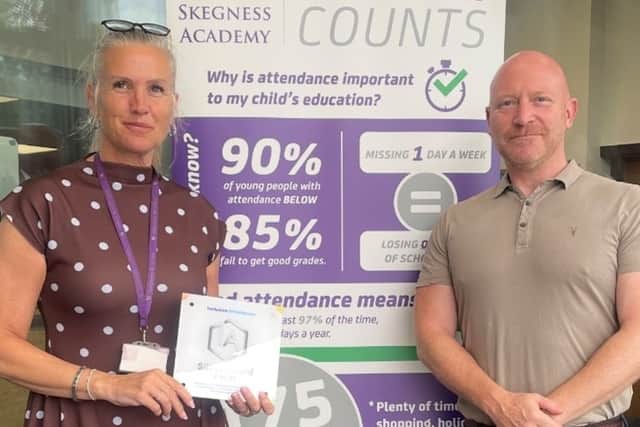 Sarah Ferrier, Senior Assistant Principal, proudly displays Skegness Academy's Inclusive Attendance Silver Award alongside Mr Wayne Harris (CEO and Founder of Inclusive Attendance Ltd) following the successful accreditation