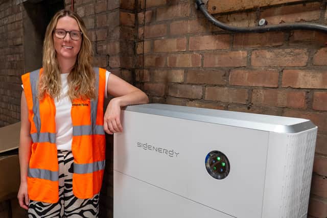 Ellie Good, Chief Purpose Officer, with the recently installed battery