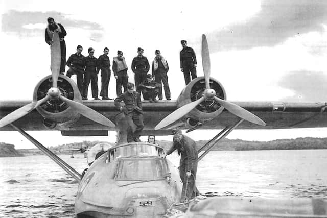119 Sqn Catalina FP529 and F/Lieut J.V. Gibson and crew, Castle Archdale, 3rd August 1942. This was one of very few amphibian versions of the PBY Catalina to serve with the RAF.