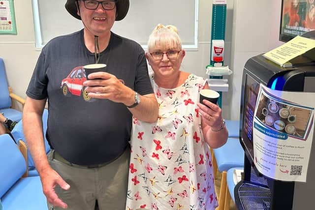 Chris and Gudrun Frankish with the coffee machine they raised funds for
