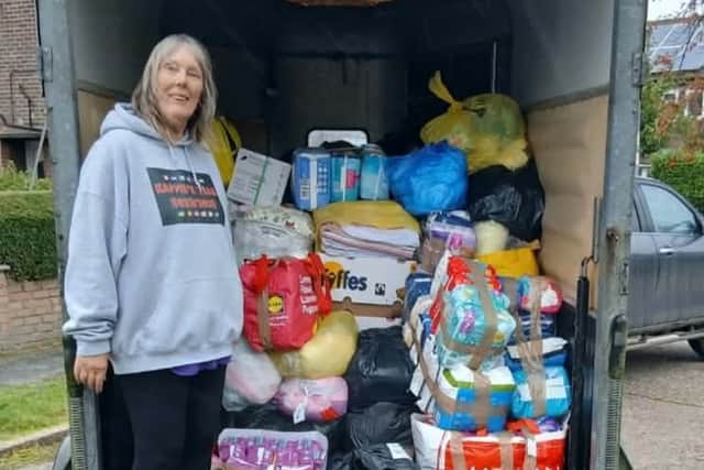 Lynn Atkinson of Blyton loads her consignment