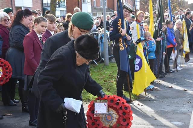 Margaret Cherry, 101, laying a wreath at the memorial. Photo: Barry Robinson.
