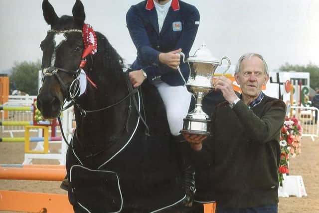 Robin Ayres presents the memorial trophy to this year's winner, Olivia Poole, of Shrewsbury.