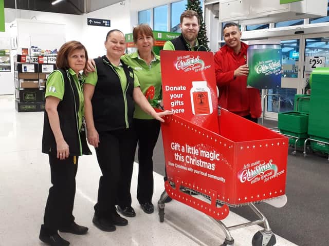Staff at Boston's Asda get ready for Christmas donations