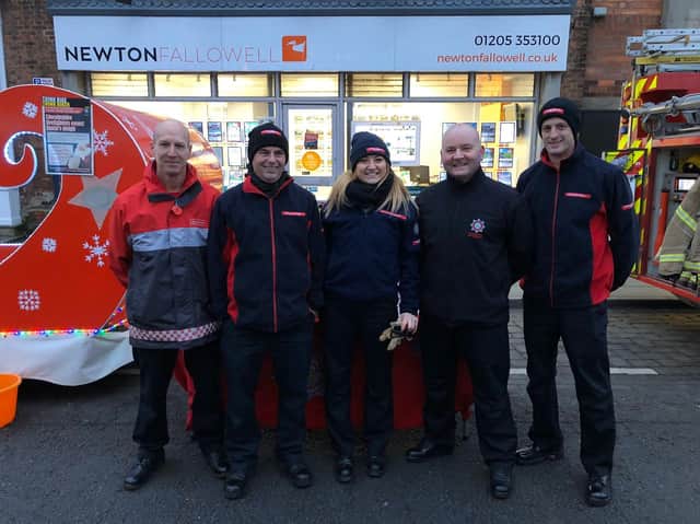 The picture shows members of the Boston crew witth their sleigh along with Abbie.