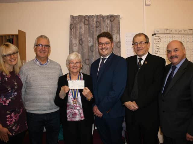 Pictured at the cheque presentation are Kirsty Meik, chairperson; Elizabethan Singers; Andrew Willoughby, director of music; Elizabethan Singer's; Ann Lincoln, chairman; Royal British Legion, Alford; Josh Wilkinson, musical director, Alford Silver Band; John Johnson, secretary, Alford Branch, Royal British Legion; and Mike Green - chairman, Alford Silver Band.