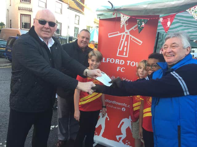 Andrew Leaper (The Worshipful Master) from the Hamilton Masonic Lodge in Alford ( left) hands over a 500 cheque to Alford Town Football Clubs chairman, Keith Thrower, at the Alford Christmas Spectacular Market. Others in the
picture are (from left) Paul Darlaston (also from Alford Masons), and Morti Woodhall,
Truman Woodhall &amp; Sam Howards (all from the Alford Town U12 Robins team).