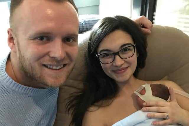 The family enjoy one of their first cuddles