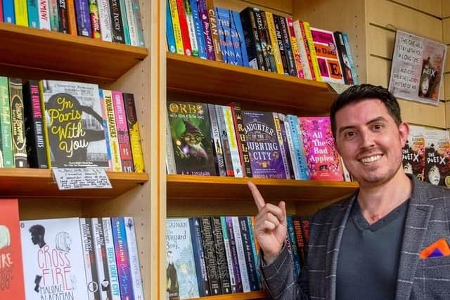 Adam Richardson with his new book.